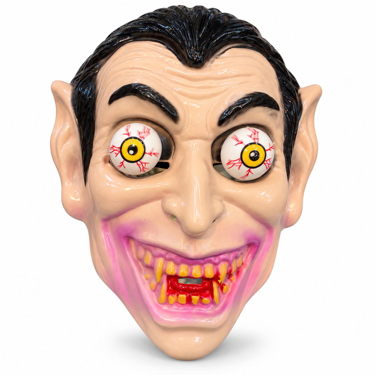 Plastic vampire face mask with bulging bloodshot eyes and fangs on white background
Child or adult wearing vampire mask with bulging eyes at a Halloween party
Close-up of bloodshot yellow bulging eyes on vampire Halloween mask
Close-up of blood-tipped fangs and grin on Dracula costume mask