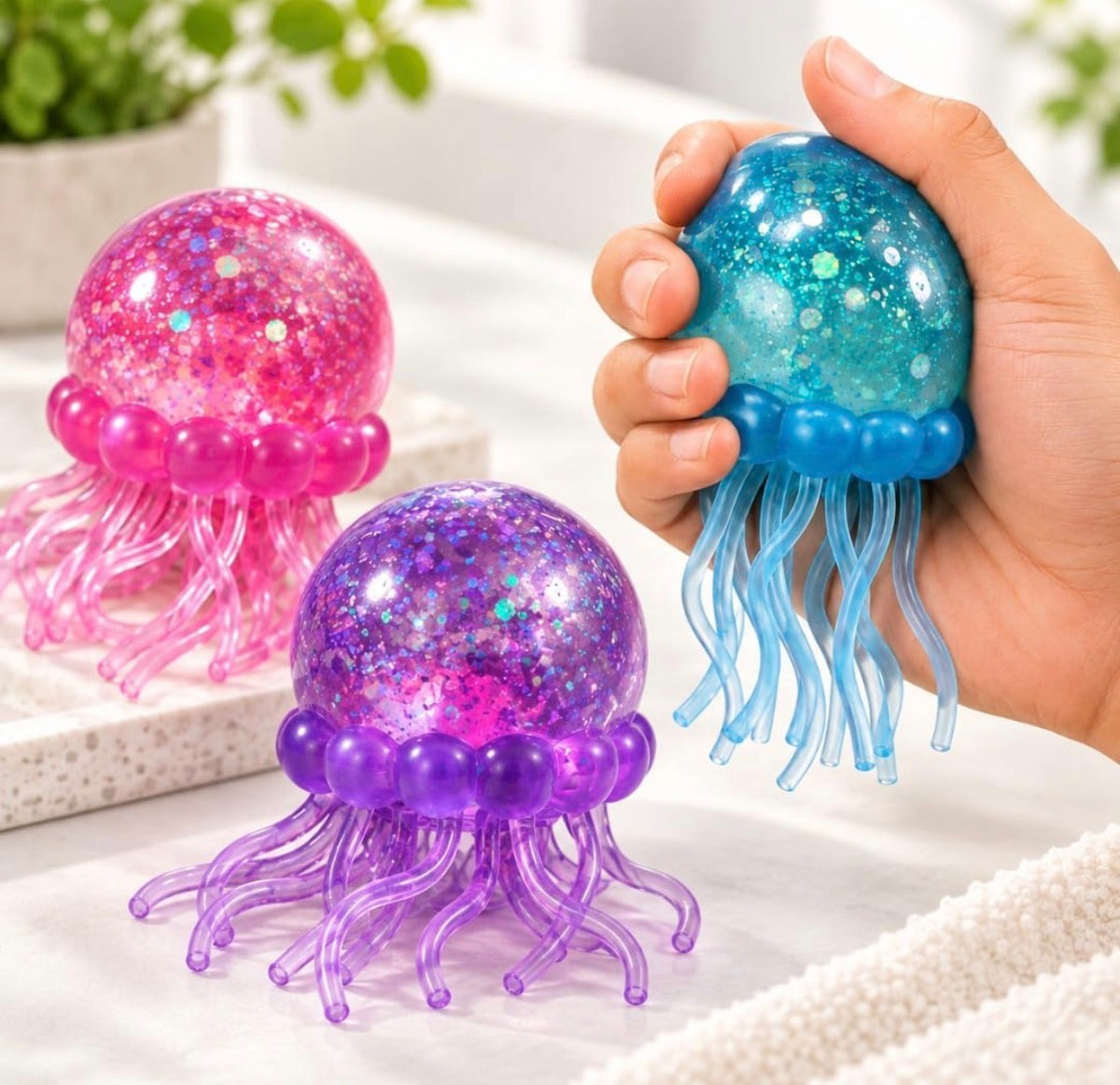 NeeDoh Jelly Squish Glitter Jellyfish Squishy, Slow Rise Stress Ball in 3 Colours