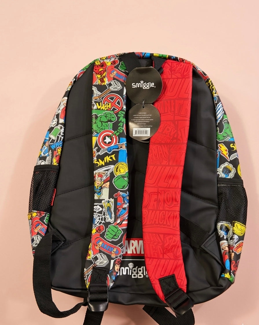 Marvel Comics Smiggle Kids School Backpack – Rubber Comics Badge, Vintage Sticker Bomb All-Over Print & Hero Name Emboss Panel, Multi-Compartment Bag for Boys Ages 5+, Red/Black/Multi