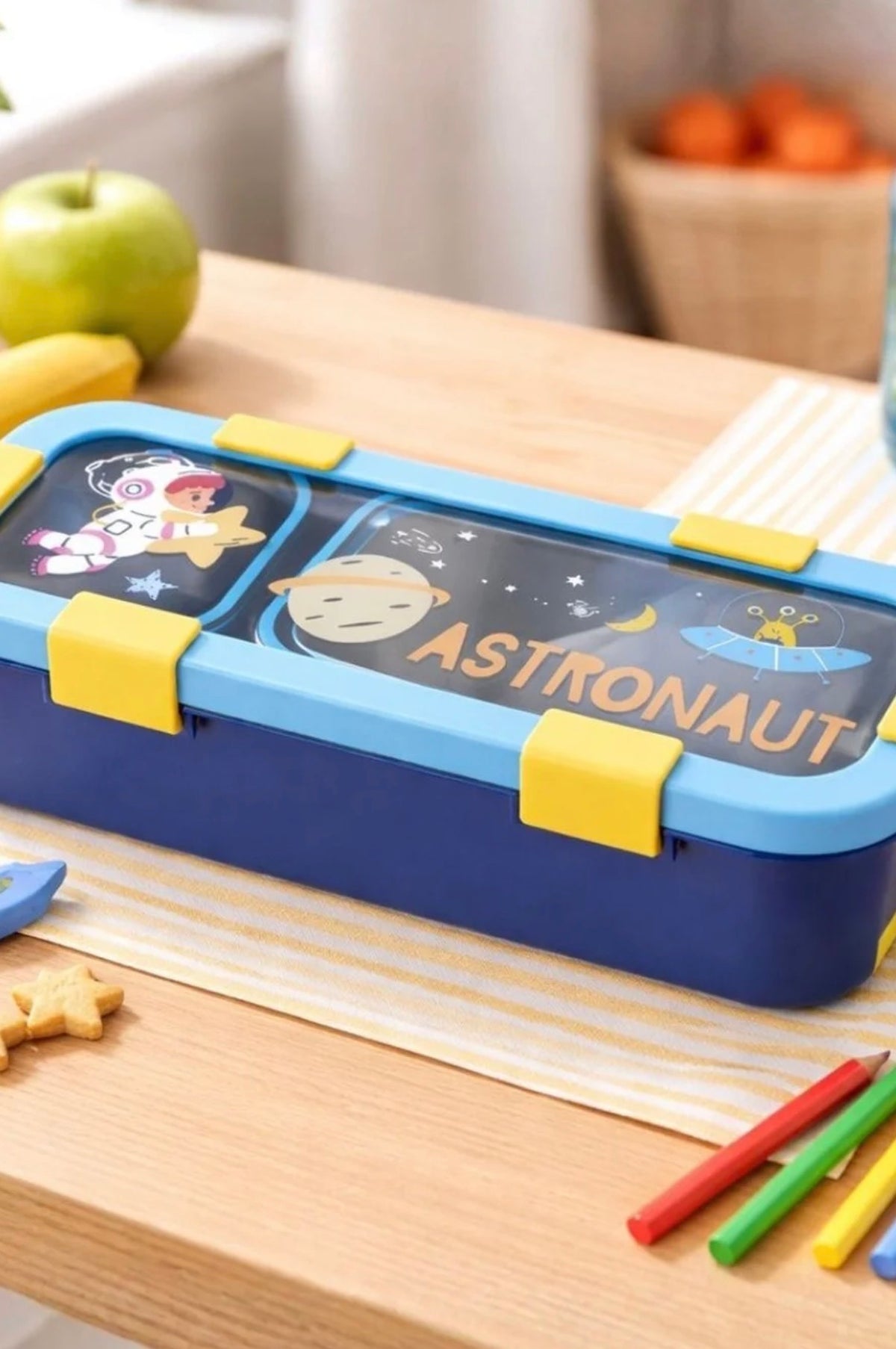 Blue astronaut steel lunch box for kids on school desk